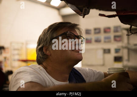 Male mechanic servicing a car Stock Photo