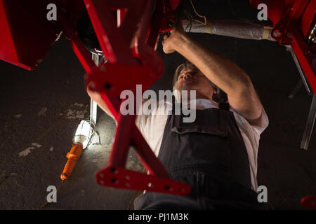 Male mechanic servicing a car Stock Photo