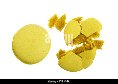 broken yellow macarons isolated on white background closeup. Stock Photo