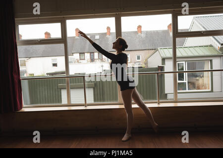 Ballerina practice arabesque ballet position Stock Photo