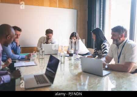 Business people working in conference room Stock Photo