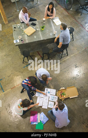 Business people discussing over documents Stock Photo