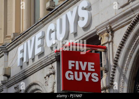 Sign above the Five Guys Burger Restaurant, London, UK Stock Photo