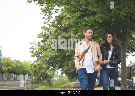 Couple walking on street in the city Stock Photo