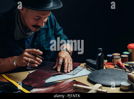 Working process of making shoes in workshop. Stock Photo