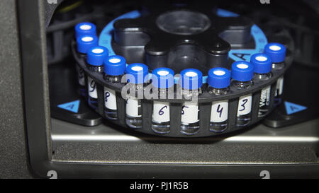 Medical centrifuge for mixing in the laboratory. Tubes prepared in lab centrifuge machine . Modern technologies in medical equipment Stock Photo