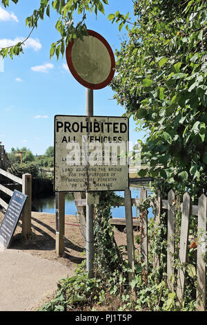 A sign prohibiting certain vehicles from crossing the bridge at Flatford Mill, Flatford Road, East Bergholt, Colchester, UK Stock Photo