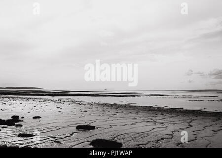 The Severn Estuary mud flats (on the English side) at low tide in black and white Stock Photo
