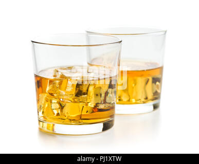 Glass of alcoholic drink with ice cubes isolated on white background. Whiskey in glass. Stock Photo