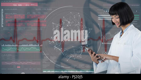 Composite image of doctor using digital tablet against white background Stock Photo