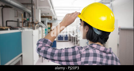 Composite image of female architect wearing hard hat against white background Stock Photo