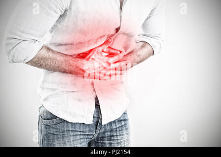 Composite image of mid section of man suffering from stomach pain Stock Photo