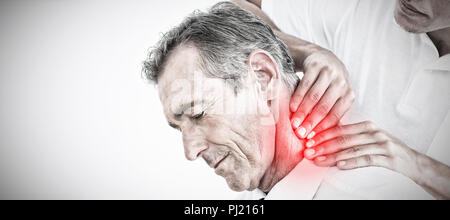Composite image of male chiropractor massaging patients neck Stock Photo
