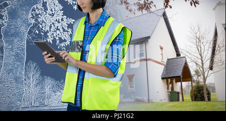 Composite image of female architect using digital tablet Stock Photo