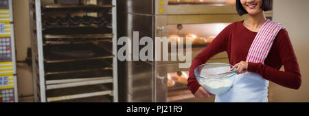 Composite image of smiling female chef mixing flour in bowl with whisk Stock Photo