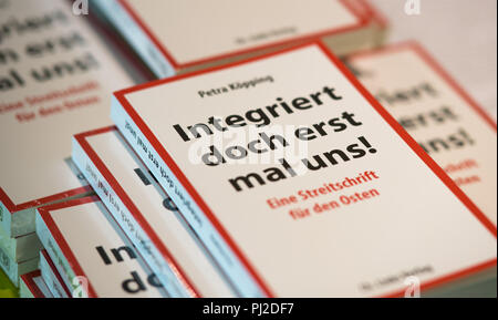 Dresden, Germany. 04th Sep, 2018. 04.09.2018, Saxony, Dresden: Copies of the new book by Petra Köpping (SPD), Minister of Integration of Saxony, under the title book 'Integriert doch erst mal uns!' (Integrate us first!), are on the table at a press conference. Credit: Monika Skolimowska/dpa-Zentralbild/dpa/Alamy Live News Stock Photo