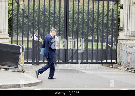 London, UK. 4th September 2018. British Conservative party politician and Member of Parliament Jacob Rees-Mogg on his phone passing the Houses of Parliament today. Credit: Kevin Frost/Alamy Live News Stock Photo