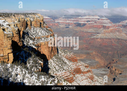 Snow covers the cliff faces and formations along the South Rim at Grand Canyon National Park in Arizona following a winter storm. Stock Photo
