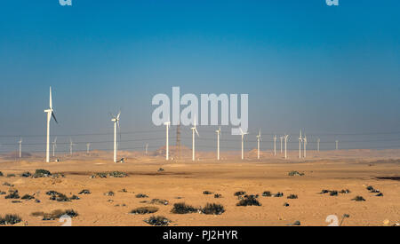 Electric wind turbine generators in the desert in Egypt Stock Photo