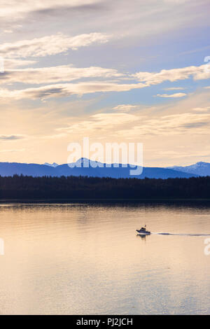 Sunrise in Icy Strait at the entrance to Glacier Bay, Alaska, USA - Viewed from a cruise ship sailing the Inside Passage Stock Photo