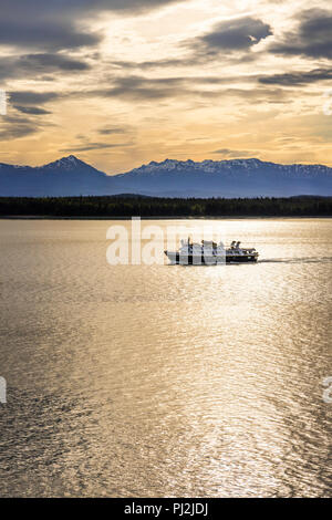 National Geographic tour ship 'Sea Lion' at dawn in the entrance to Glacier Bay, Alaska, USA - Viewed from a cruise ship sailing the Inside Passage. Stock Photo