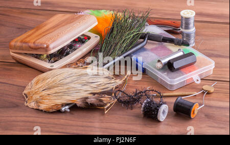 Various materials for knitting insects. Feathers, fur, thread. Stock Photo