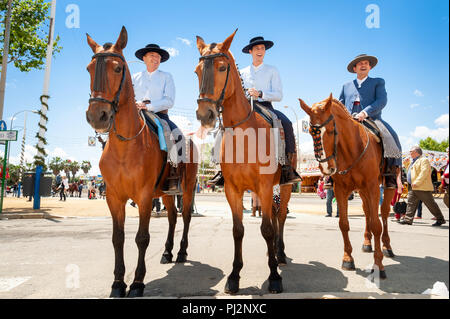Men on horses during the Feria de Seville, Spain Stock Photo