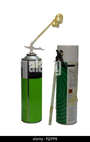 two previously used foam sealant cans, designed for home use without special tools, but with tubes for pouring of the foam in narrow gaps. isolated Stock Photo