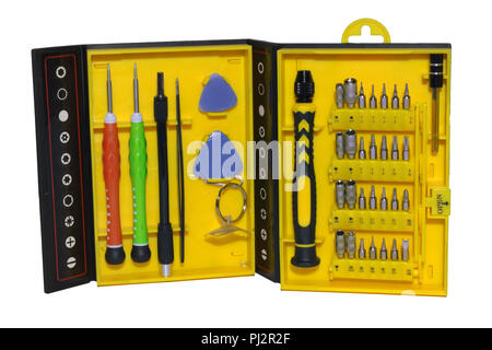 tools set in a yellow box. bits, screwdrivers and other instruments for precision work and phone repairing. isolated on white with clipping path Stock Photo
