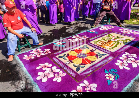 Antigua, Guatemala -  March 22, 2015: Lent procession carpet in colonial town with most famous Holy Week celebrations in Latin America. Stock Photo