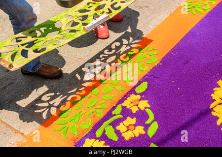 Antigua, Guatemala -  April 2, 2015: Making Holy Week procession carpet in colonial town with most famous Holy Week celebrations in Latin America. Stock Photo