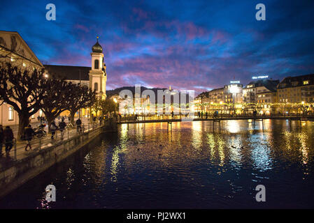 Lucerne onion domes of St. Francis Xavier Jesuit Church and pedestrian footbridges over the River Reuss, Switzerland. Stock Photo