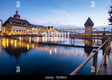 Lucerne, Switzerland iron footbridge and covered wooden footbridge, Kapellbrücke, or Chapel Bridge. Stock Photo