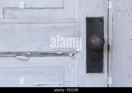 old paint peeling from wood door Stock Photo