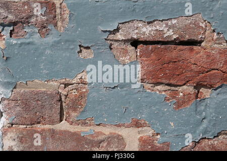 old paint peeling from brick wall Stock Photo