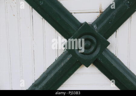 structural metal piece on old farm building Stock Photo