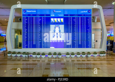 Flight schedule board in Dubai airport Stock Photo