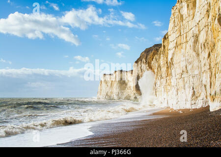 Chalk cliffs between Seaford and Newhaven, near Tide Mills, East Sussex, Enlgand on a windy day in a high tide, selective focus Stock Photo