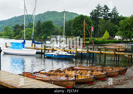 Boats in Bowness on Windermere, view of the lake and mountain on the back, Cumbria, selective focus Stock Photo