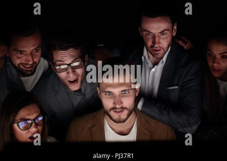 close up. the programmer and his colleagues are working late Stock Photo
