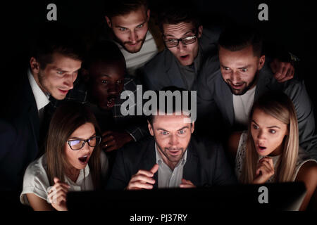 close-up of businessman and business team looking at computer monitor Stock Photo