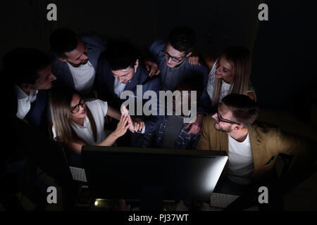 business team enjoys good news and congratulating each other on success Stock Photo