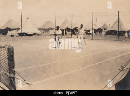 Vintage 1919 Photograph of British Army Soldiers Playing Tennis in a Camp at C.M.B, Kantara, Middle East Stock Photo