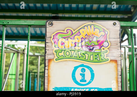 sign for the Cat-O-Pillar roller coaster ride at Paultons Park, Ower, Romsey, Southampton, England, United Kingdom. Stock Photo