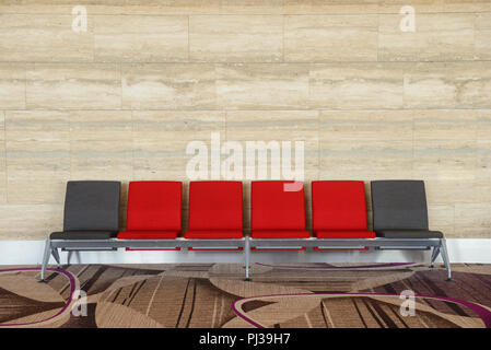 Rows chairs in the waiting area with marble background Stock Photo
