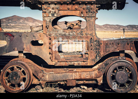 Wheel of an old rusty wagon abandoned in the train cemetery of Uyuni, Bolivia Stock Photo