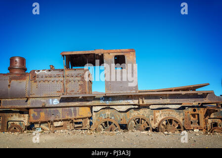 Old rusty locomotive abandoned in the train cemetery of Uyuni, Bolivia Stock Photo