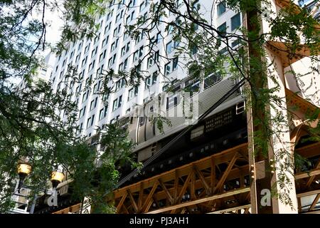 Quintessentially Chicago: elevated train amongst high rise buildings Stock Photo