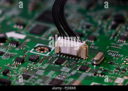 Lcd tv electronic circuit. Green color, faded at the sides. Stock Photo