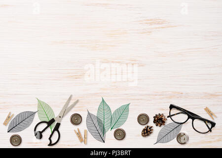 Craft elements and tools on white painted wooden background. Flat lay. Top view. Stock Photo